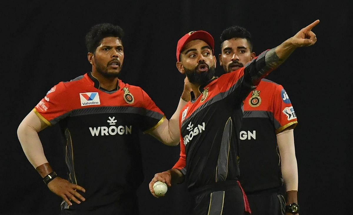 POOR SHOW: The pace duo of Umesh Yadav (left) and Mohammed Siraj (right) have failed to deliver for RCB this season. AFP File Photo 
