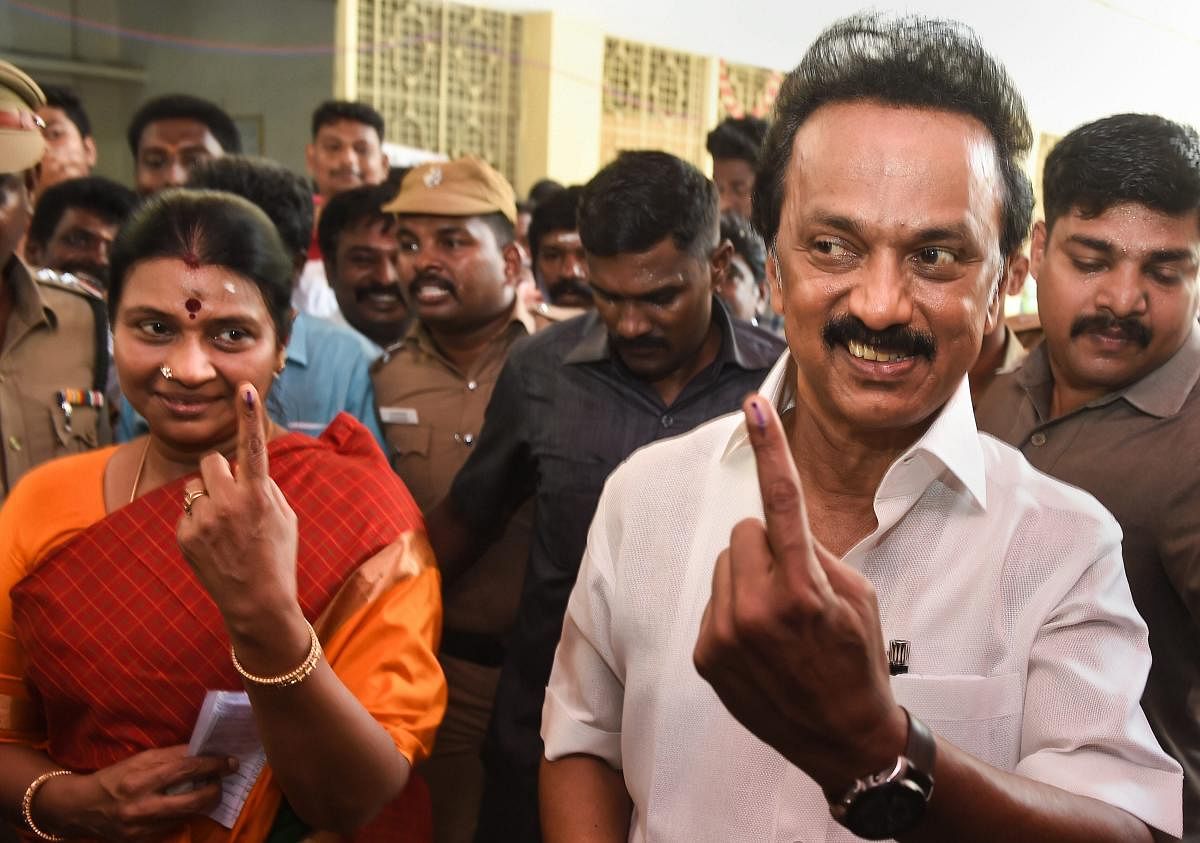DMK President MK Stalin and his wife Durga Stalin show their finger marked with indelible ink after casting vote for the second phase of the general elections, at a polling station in Chennai, Thursday, April 18, 2019. (PTI Photo)