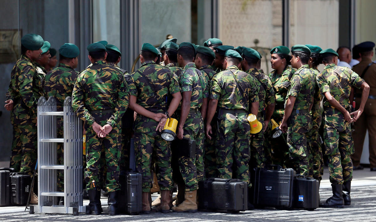 "A curfew will be imposed until things settle down," he told reporters in Colombo. Reuters photo