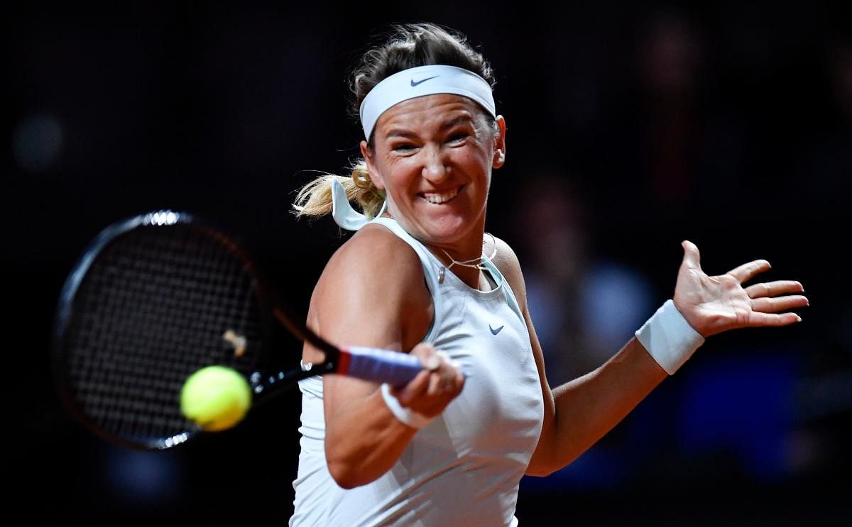 FIERCE: Belarus' Victoria Azarenka returns during her win over Russia's Vera Zvonereva. AFP