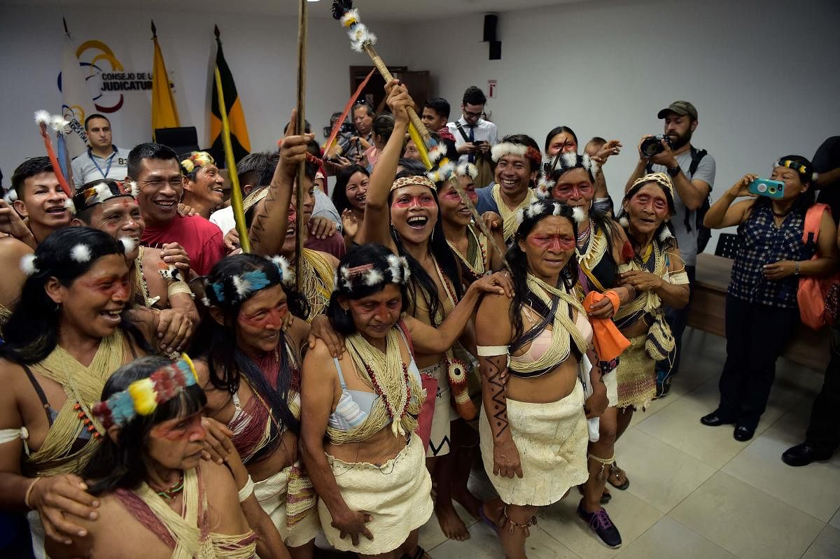 Waorani indigenous people celebrate after a court ruled in their favour on the tribe's legal challenge to the government's land selloff, at the end of the protection action hearing in Puyo, Ecuador, on April 26, 2019. (AFP)