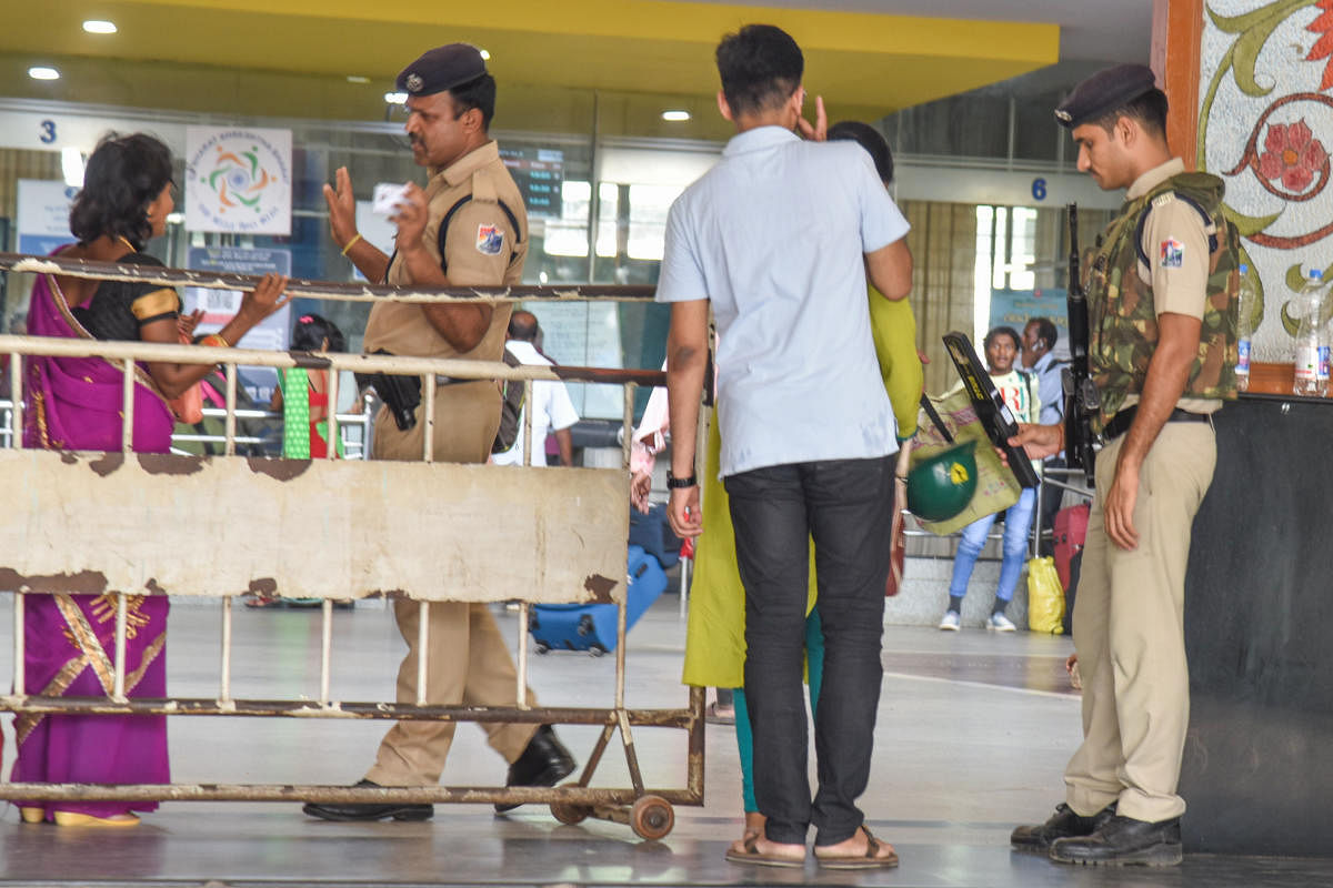 Railway Protection Force person guarding Krantivira Sangolli Rayanna City Railway station, during high alert for terror attack treat in Bengaluru on Monday. Photo by S K Dinesh