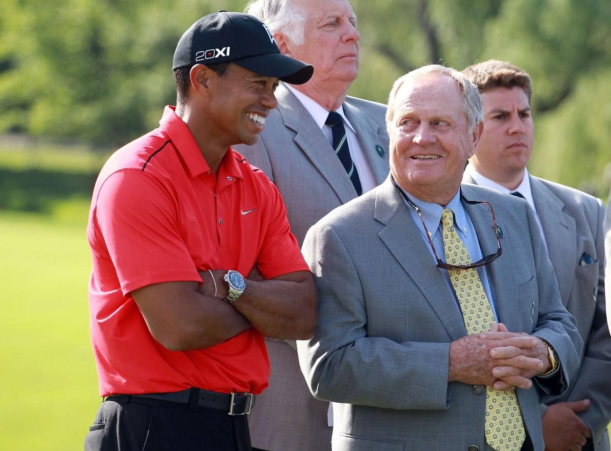 Golfing great Jack Nicklaus (right) feels a resurgent Tiger Woods can go past his record of 18 major victories. AFP