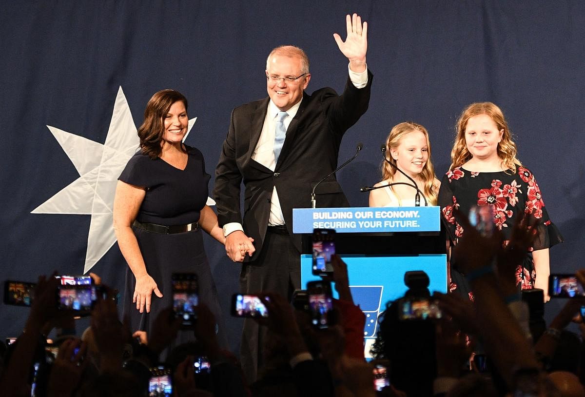 Australia's newly elected Prime Minister Scott Morrison (C) arrives to deliver a victory speech with his family after winning Australia's general election in Sydney on May 18, 2019. (Photo by AFP)