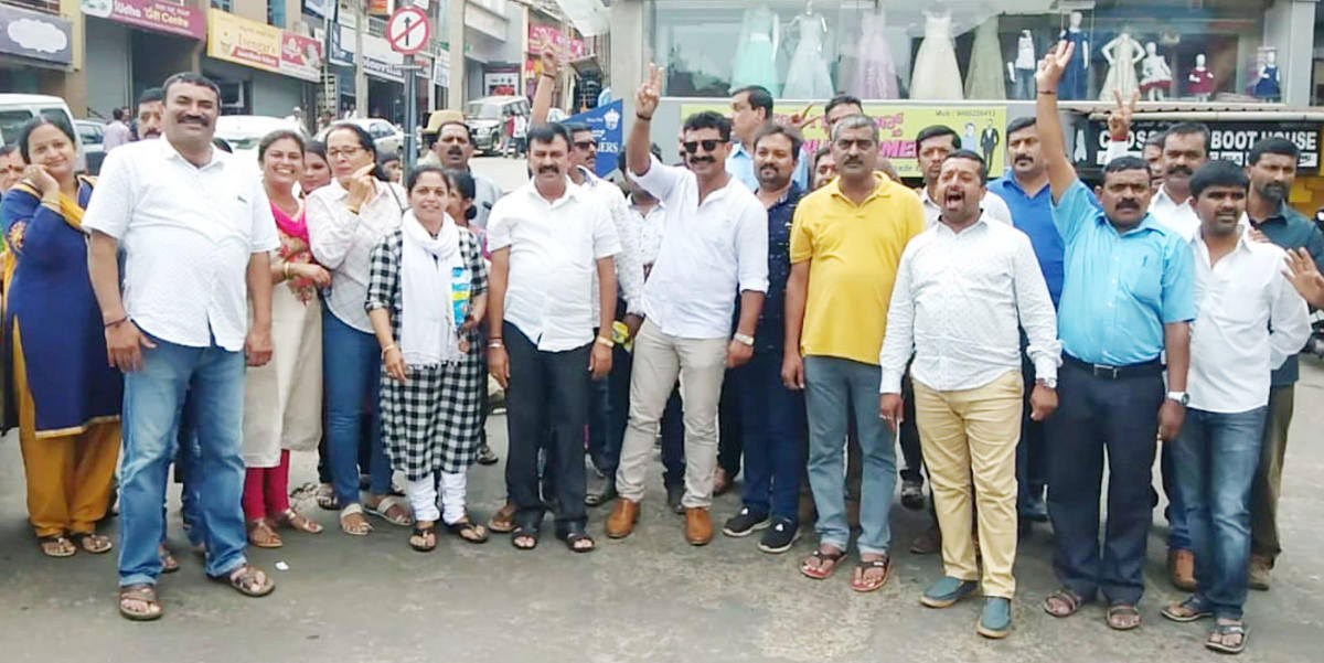 BJP workers celebrate victory at Indira Gandhi Circle in Madikeri on Thursday.