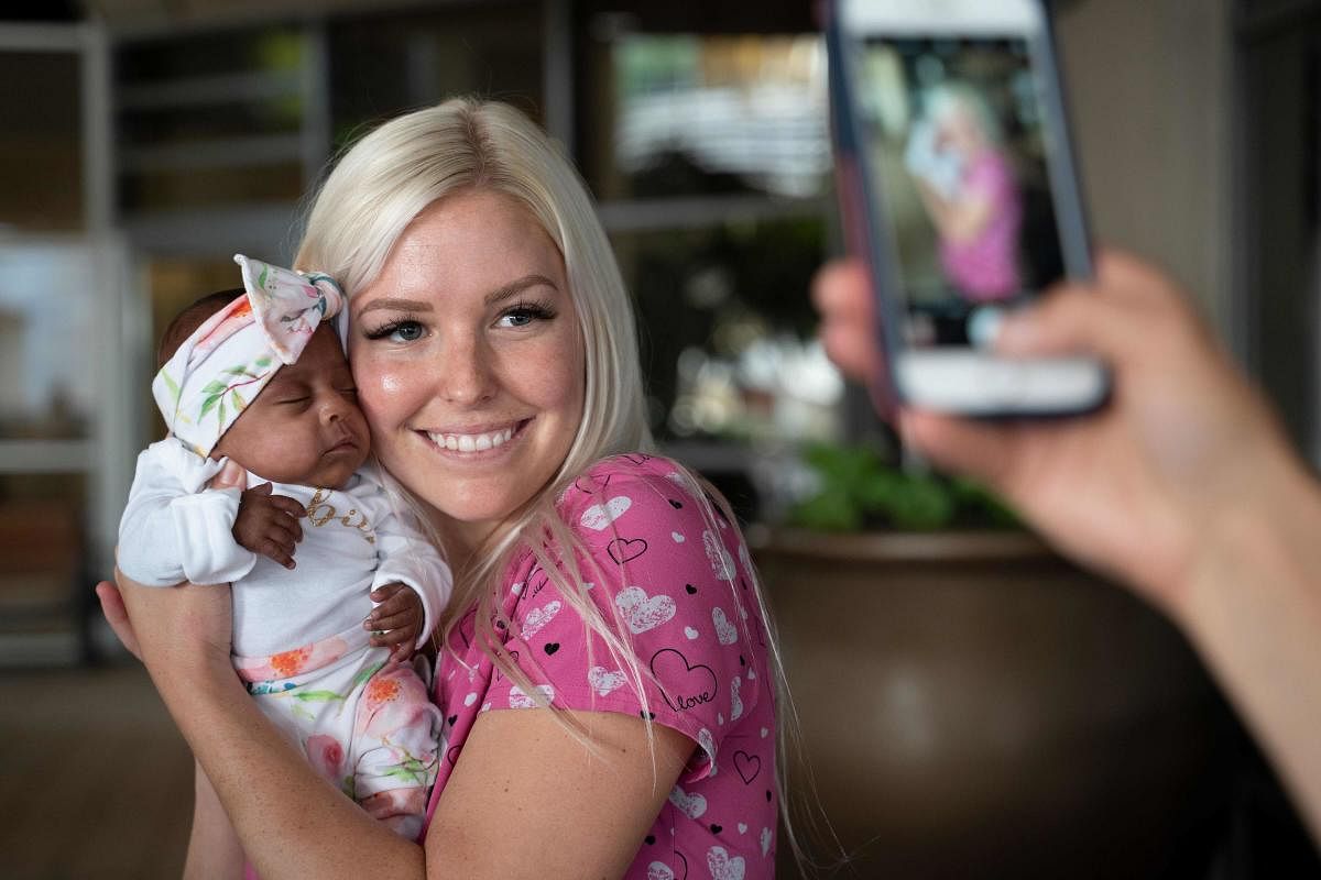 A nurse holding baby Saybie, the world's smallest surviving newborn, on the day she was released from the NICU in San Diego, California. (AFP Photo)