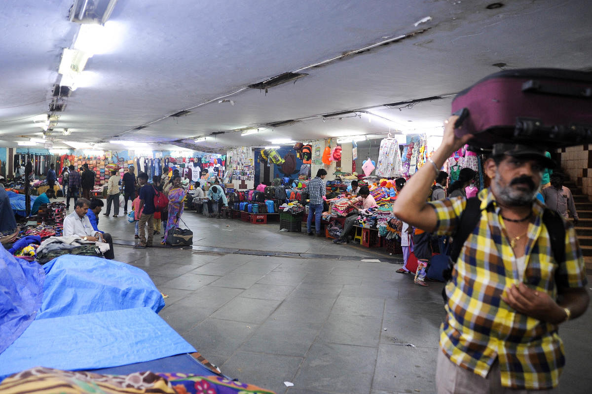 The subway at the KSR City railway station is lined with vendors again, weeks after they were evicted in August in accordance with a High Court order. DH Photos by Pushkar V