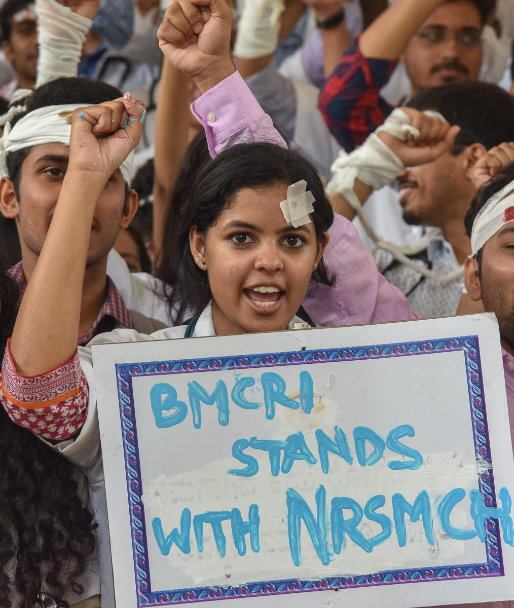 Interns and Junior Resident Doctors staging protest against assault on Junior Doctors, in NRSMCH, Kolkata, West Bengal and support Kolkata NRSMCH Junior Doctors, demanding government give security to Doctors, organised by Resident Doctors Association of Bangalore Medical College and Research Institute (BMCRI), Victoria Hospital in Bengaluru on Friday. Photo by S K Dinesh