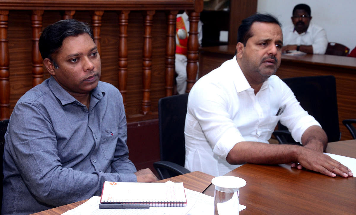 District In-charge Minister U T Khader speaks at a review meeting at the deputy commissioner’s office in Mangaluru on Saturday. Deputy Commissioner Sasikanth Senthil is seen.
