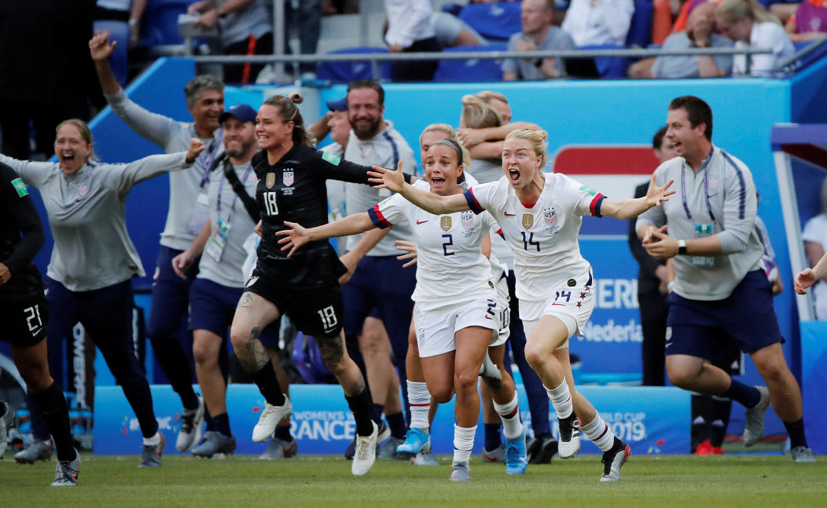 Emily Sonnett of the US, Mallory Pugh of the US and teammates celebrate at the end of the match after winning the Women's World Cup. (REUTERS)