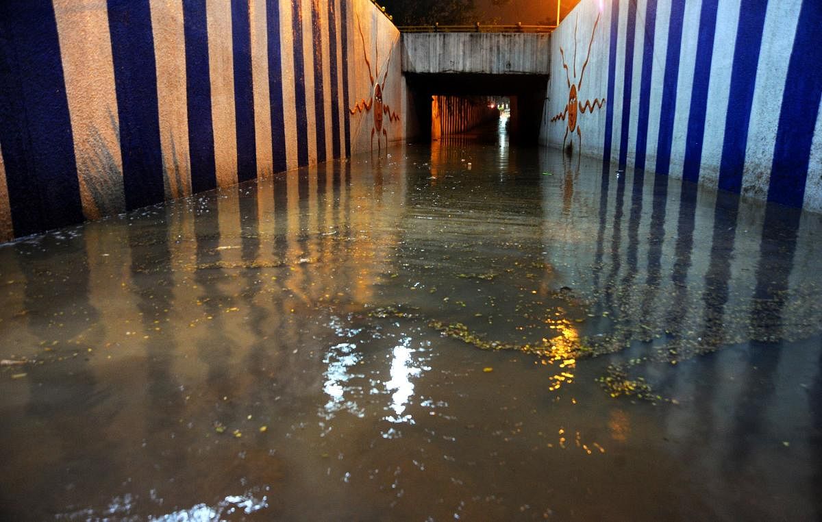 With a few minutes of rainfall, the underpass near KR Circle was seen inundated on Wednesday. DH PHOTO/Pushkar V