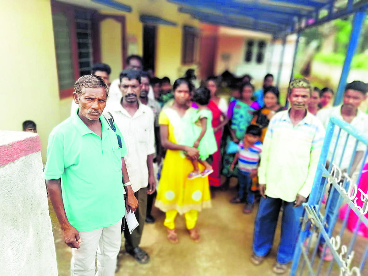 Tribal people who came for Aadhaar registration conducted by the district administration at Ashrama School in Nittur on Thursday.