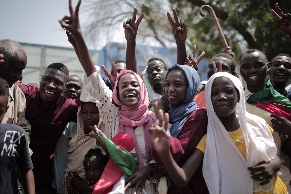 Sudanese men and women. AFP file photo 