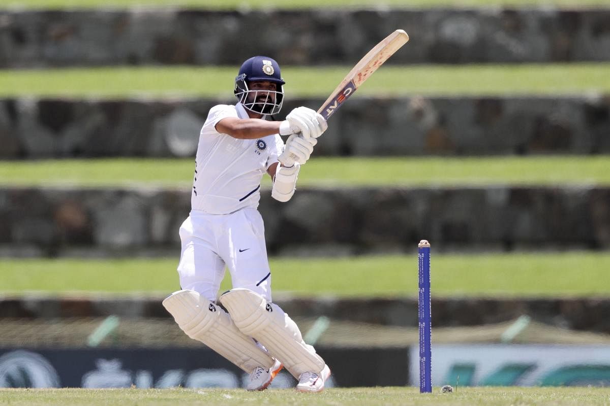 North Sound: India's Ajinkya Rahane plays a shot against West Indies during day one of the first Test cricket matches at the Sir Vivian Richards cricket ground in North Sound. (PTI Photo)