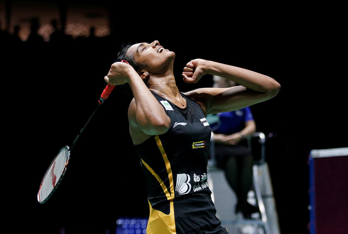 PV Sindhu cheers after winning her women's singles final match against Japan's Nozomi Okuhara at the BWF Badminton World Championships in Basel, Switzerland, Sunday, Aug. 25, 2019. AP/PTI