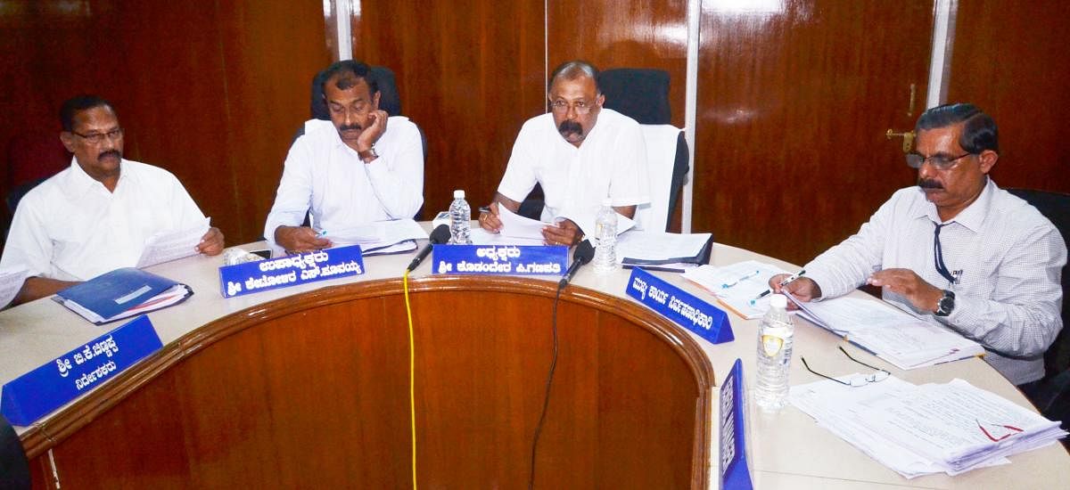 DCC Bank President Kodandera P Ganapathy speaks at a press conference at DCC Bank auditorium in Madikeri on Friday.