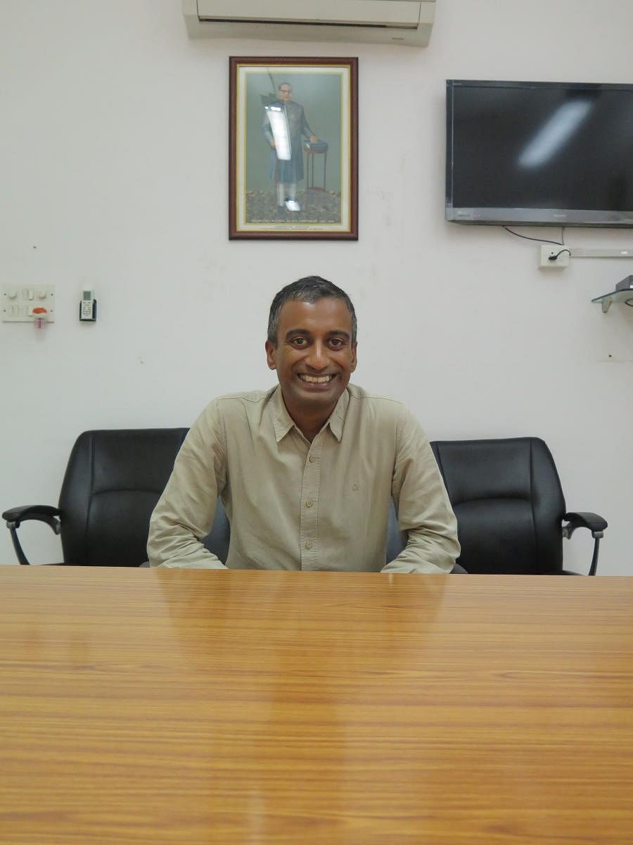 The new vice-chancellor of the National Law School of India (NLSIU), Sudhir Krishnaswamy, poses in his office in Bengaluru on Tuesday.