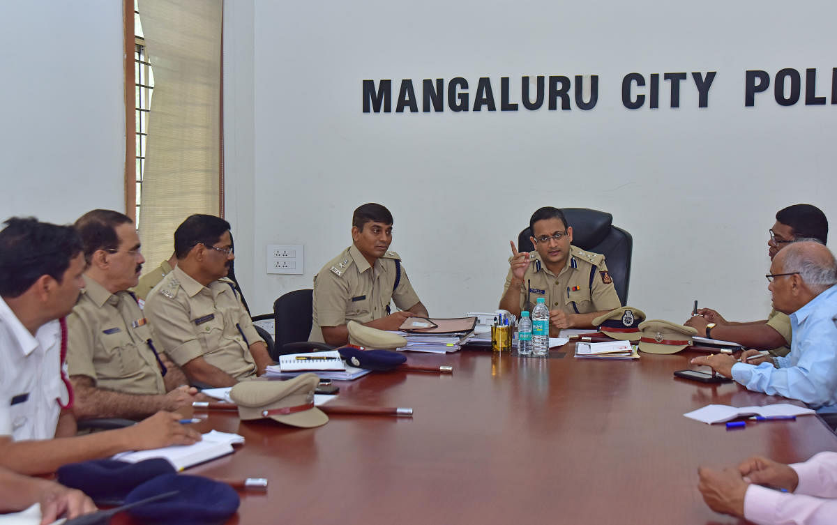 Commissioner of Police Dr P S Harsha speaks during weekly phone in programme at the Mangaluru Commissionerate Officer on Friday.