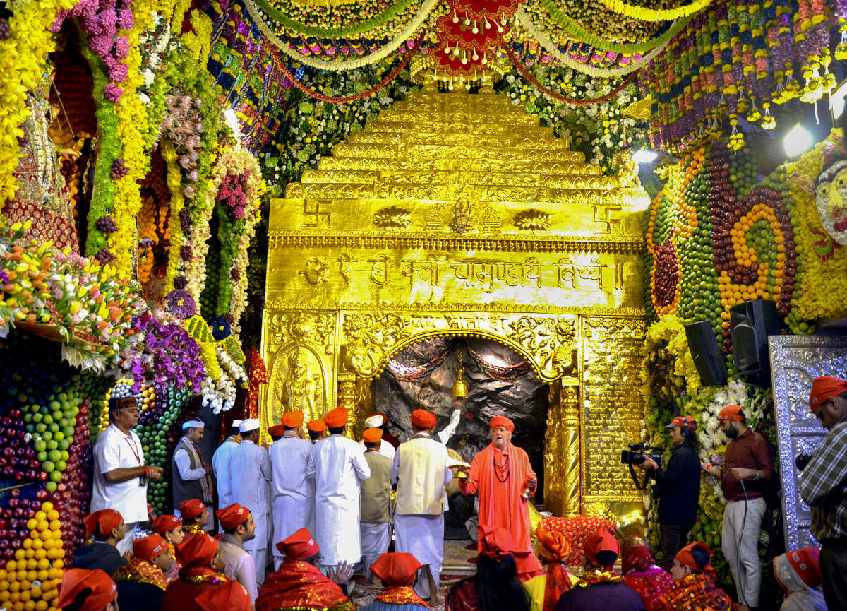 Devotees offer prayers at the holy cave shrine of Shri Mata Vaishno Devi on the occasion of 'Mahanavami', the ninth day of Navaratri festival, in Katra onMonday. (PTI Photo) 