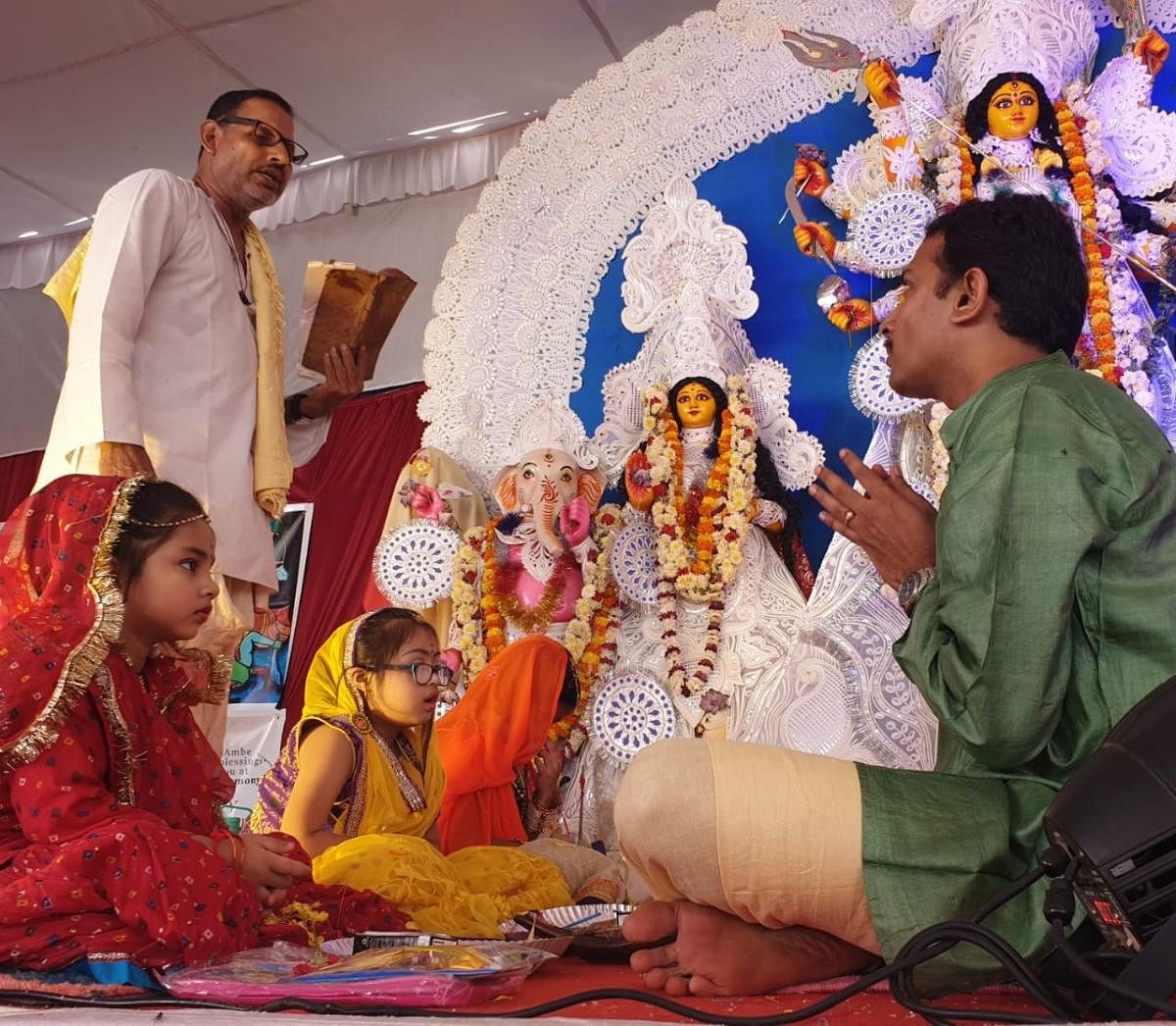 Izna Ali (dressed in red) is being worshipped during the Kumari Puja ritual. Special arrangement