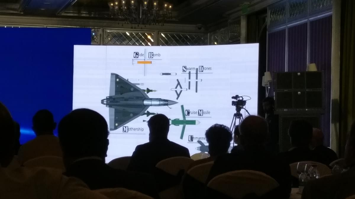 Delegates at the Synergia Conclave look at an image of drones.