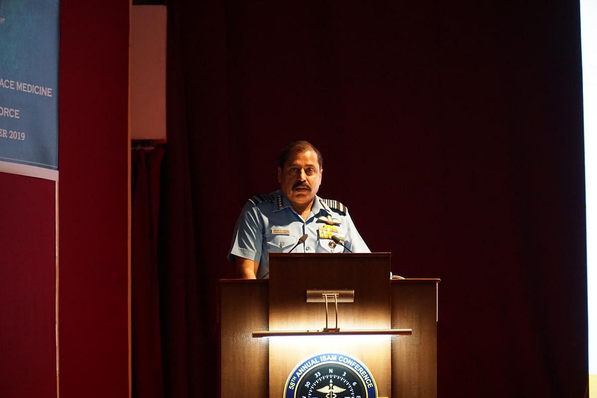 Air Chief Marshal R K S Bhadauria speaks at the 8th annual conference organised by the Institute Society of Aerospace Medicine in Bengaluru on Thursday. DH PHOTO/AKHIL KADIDAL