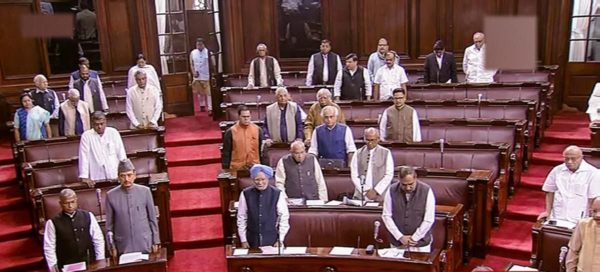 Parliamentarians observe silence during an obituary reference in the Rajya Sabha during the Winter Session of Parliament, in New Delhi. (PTI Photo)