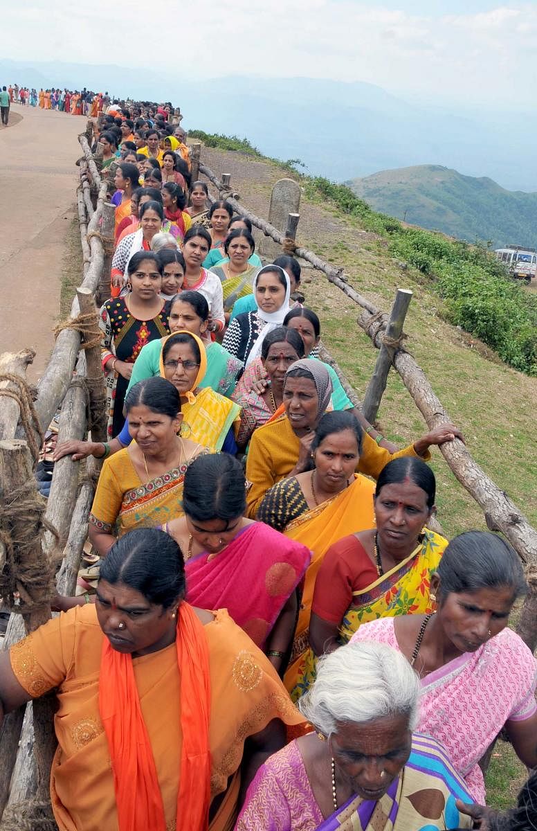 Women wait in a queue for the Darshana of Datta Paduke at Bababudangiri. dh photos