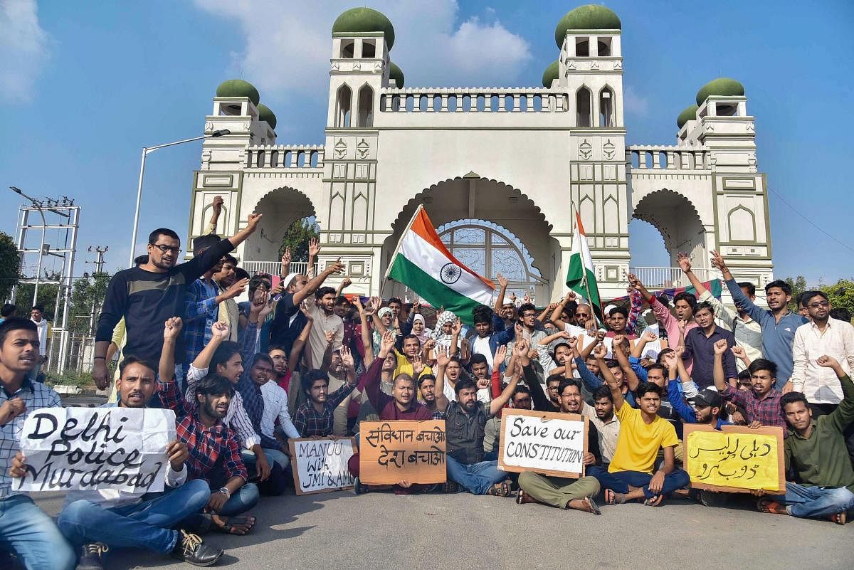 Students hold placards as they raise slogans during a protest against Citizenship Amendment Act (CAA) and National Register of Citizens (NRC) at Maulana Azad National Urdu University in Hyderabad, Tuesday, Dec. 17, 2019. (PTI Photo)