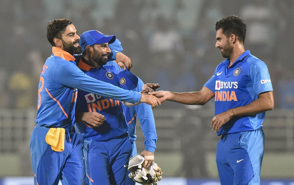 ndian captain Virat Kohli celebrates with pacers Md Shami and Deepak Chahar after their win in the 2nd ODI cricket match against West Indies at ACA-VDCA Cricket Stadium in Visakhapatnam, Wednesday, Dec. 18, 2019. (PTI Photo)