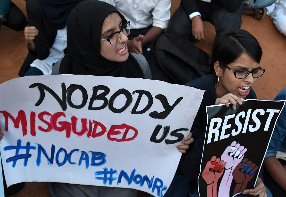 Students stage a protest at the Government Arts and Science College grounds on Friday. DH Photo/Pushkar V