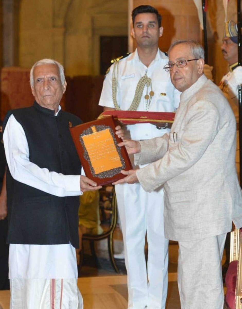 A file photo of Hostota Manjunath Bhagwat receiving Sangeet Nataka Academy Award from President Pranab Mukherjee.