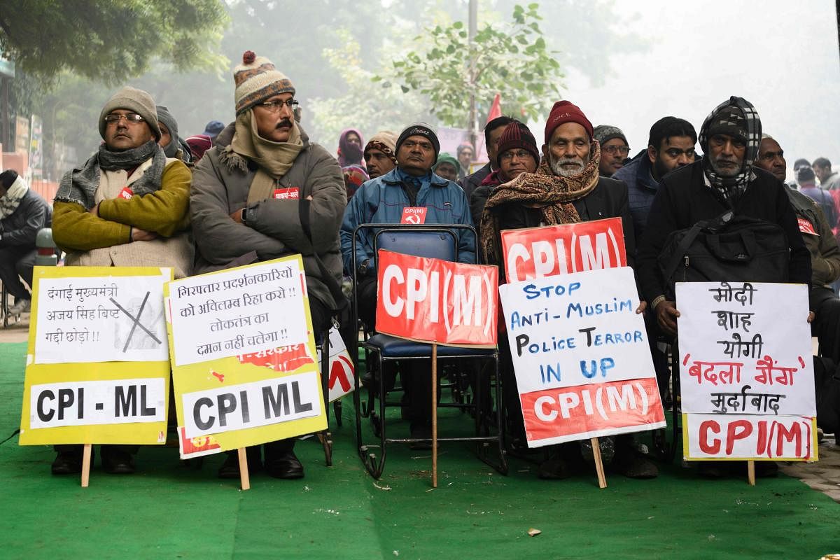 Activists of the Communist Party of India (CPI) display placards during a demonstration against India's new citizenship law in New Delhi on December 30, 2019. (AFP Photo)