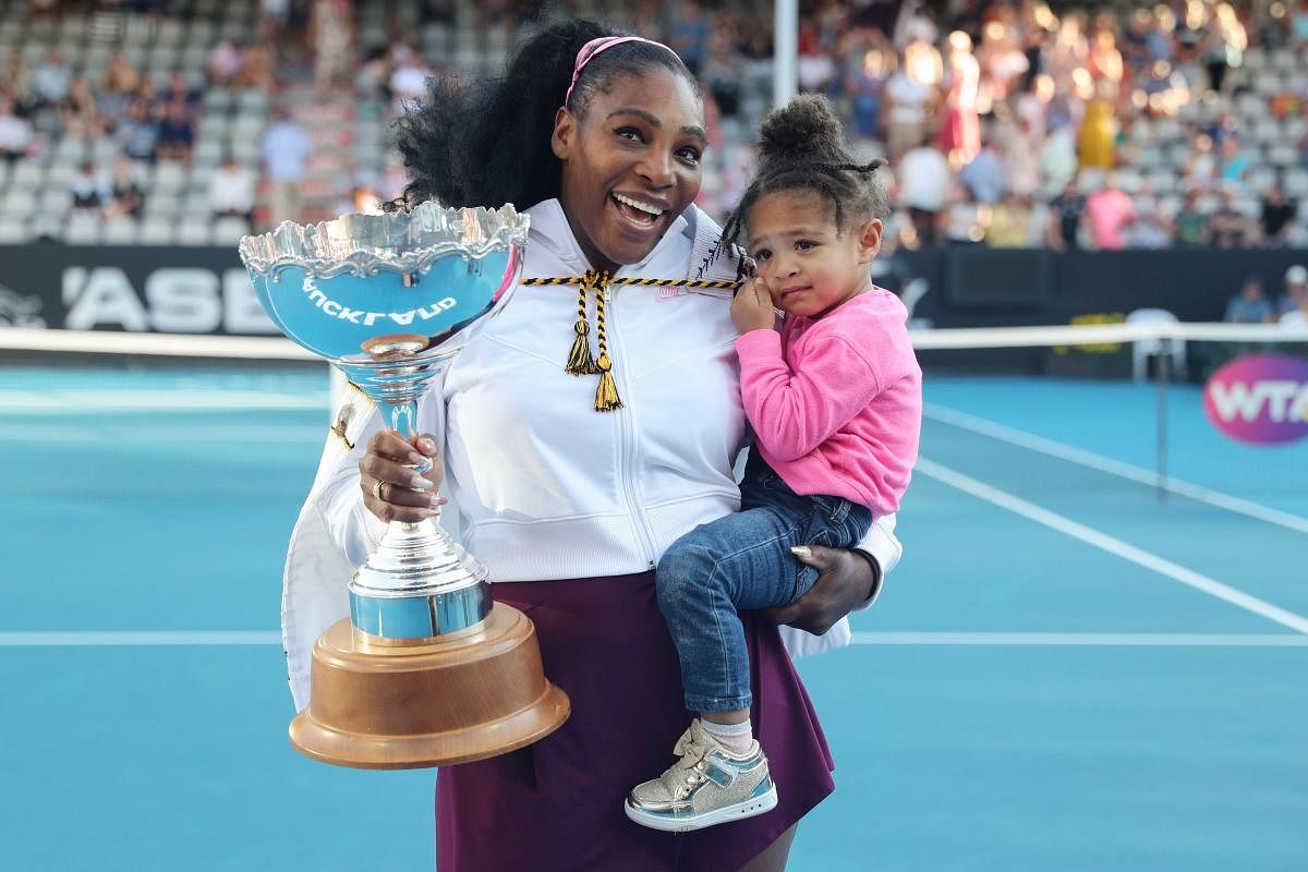 Serena Williams of the US with her daughter Alexis Olympia after her win against Jessica Pegula of the US during their women's singles final match during the Auckland Classic tennis tournament in Auckland on January 12, 2020. (AFP Photo)