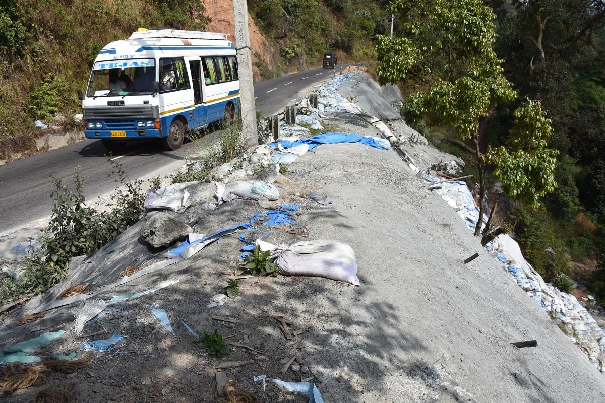 Most of the sandbags placed on the roadside on the Madikeri-Sampaje stretch of NH 275 for protection have been washed away.