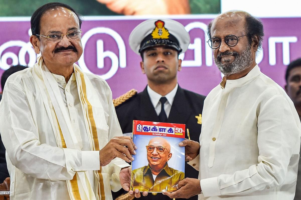 Vice President M Venkaiah Naidu along with Tamil Superstar Rajinikanth releases the 50th-anniversary souvenir of Tughlaq magazine in Chennai, on Tuesday. PTI
