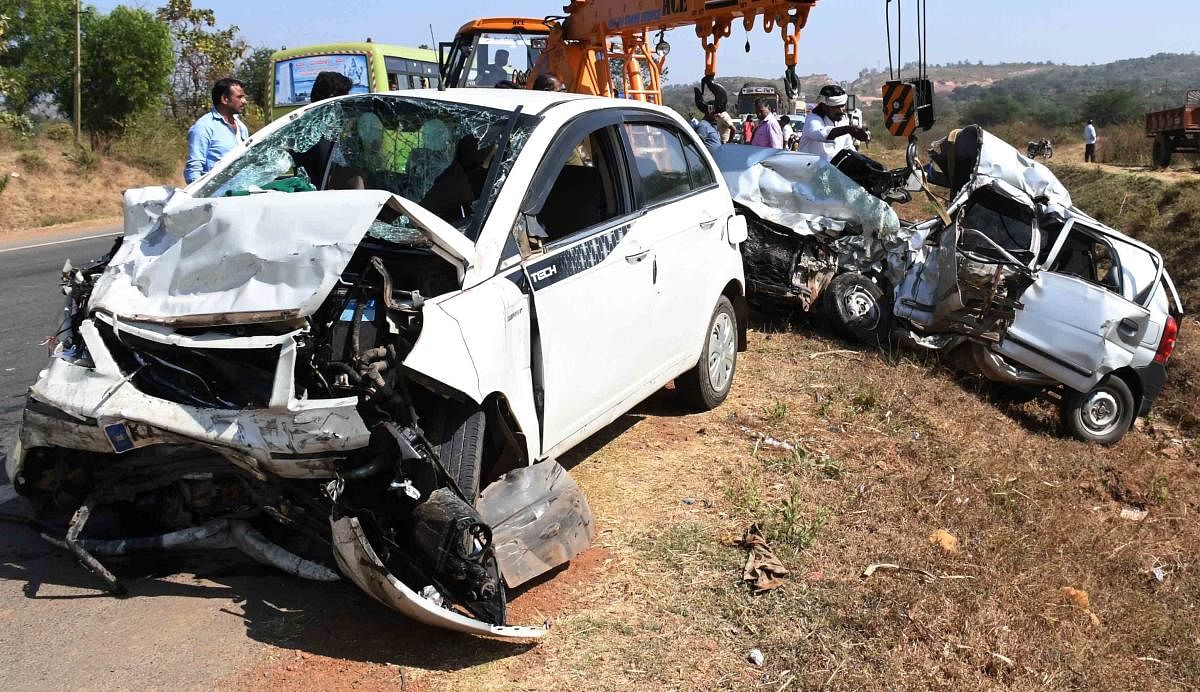 Mangled remains of two cars which hit head-on on Hubballi-Dharwad bypass near Yarikoppa Cross in Dharwad taluk on Sunday, killed four persons on the spot. DH Photo