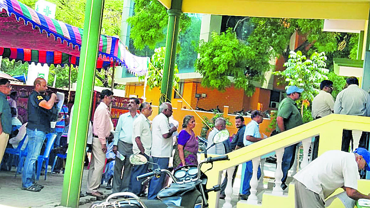 People queue up to pay tax at Mysuru City Corporation office. Dh-file photo