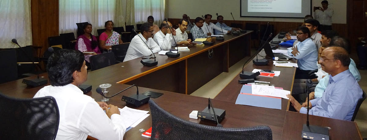 Deputy Commissioner G Jagadeesha speaks at a meeting in DC's office in Manipal.