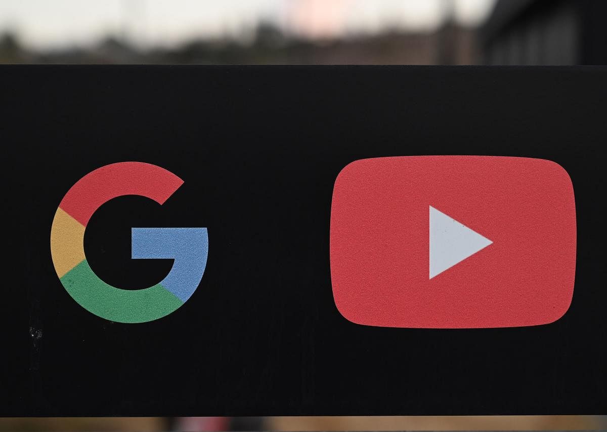 In this file photo taken on November 21, 2019, the Google and YouTube logos are seen at the entrance to the Google offices in Los Angeles, California. (AFP photo)