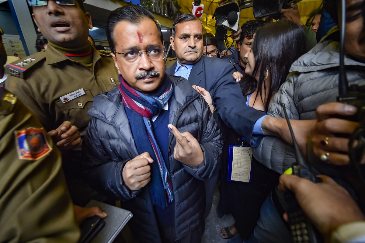 Delhi Chief Minister Arvind Kejriwal shows his finger marked with indelible ink after casting vote during the Delhi Assembly elections at Civil Line polling station, in New Delhi, Saturday, Feb. 8, 2020. (PTI Photo)