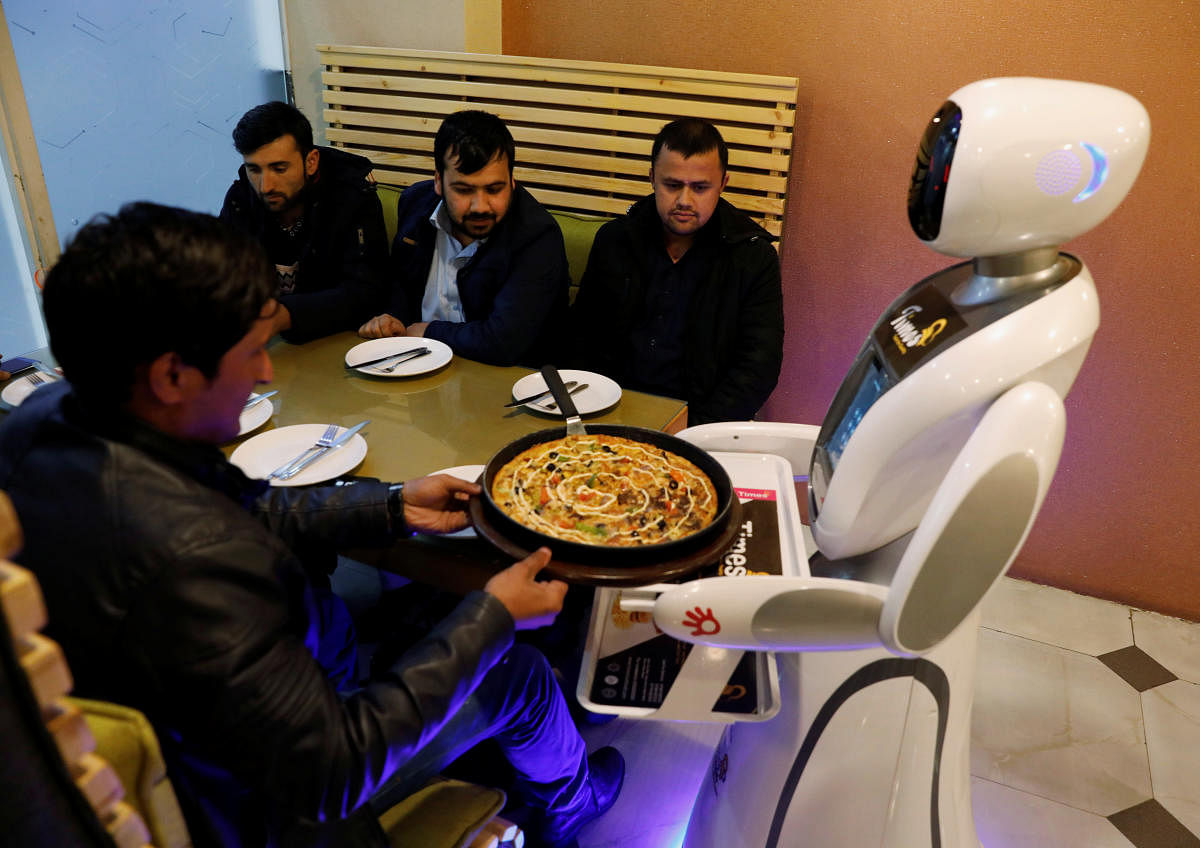 A waitress robot (Timea) delivers food to customers at the Times Fast Food restaurant in Kabul, Afghanistan February 11, 2020. (Reuters photo)