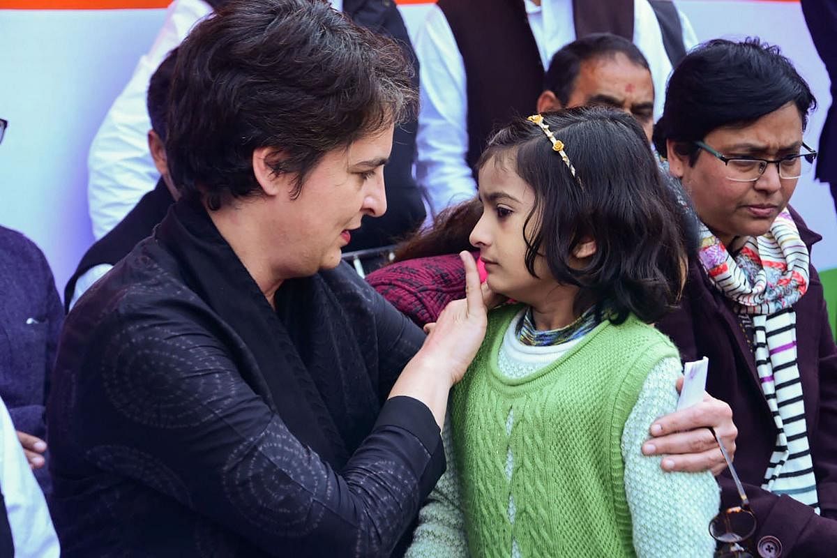 Congress General Secretary Priyanka Gandhi Vadra interacts with a girl while meeting with Muslim women who have been agitating against the Citizenship Amendment Act (CAA) and National Register of Citizens (NRC), at Bilariyaganj in Azamgarh, Wednesday, Feb. 12, 2020. (PTI Photo)