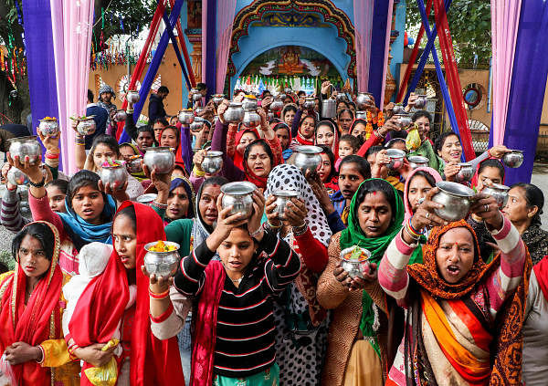 Devotees wait to offer prayers to Lord Shiva on the occasion of Maha Shivratri festival, at Aap Shambhu Temple in Jammu, Friday, Feb. 21, 2020. (PTI Photo) 