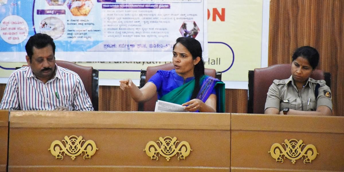 Deputy Commissioner Annies Kanmani Joy chairs a meeting at ZP auditorium on Friday.SP Dr Suman D Pennekar and DHO Dr K Mohan look on. DH Photo