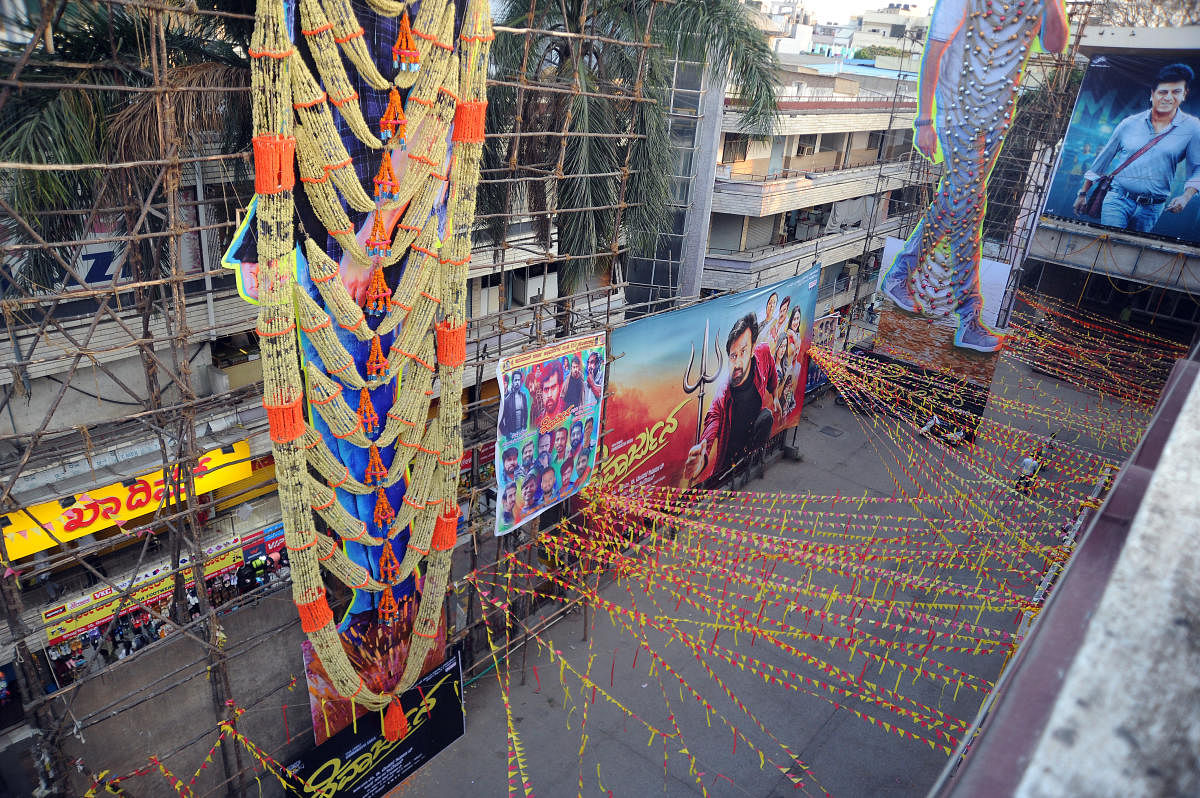 On a Friday evening, theaters in Majestic, Bengaluru wore a rather deserted look in wake of COVID-19 breakout. DH Photo/ Pushkar V