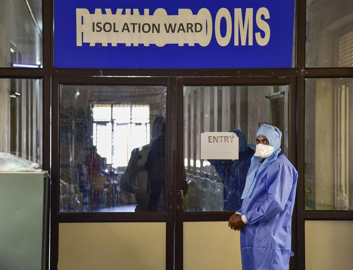 A medics stands outside an isolation ward, set up in view of coronavirus pandemic, at Gandhi Hospital in Hyderabad, Saturday, March 14, 2020. (PTI Photo)