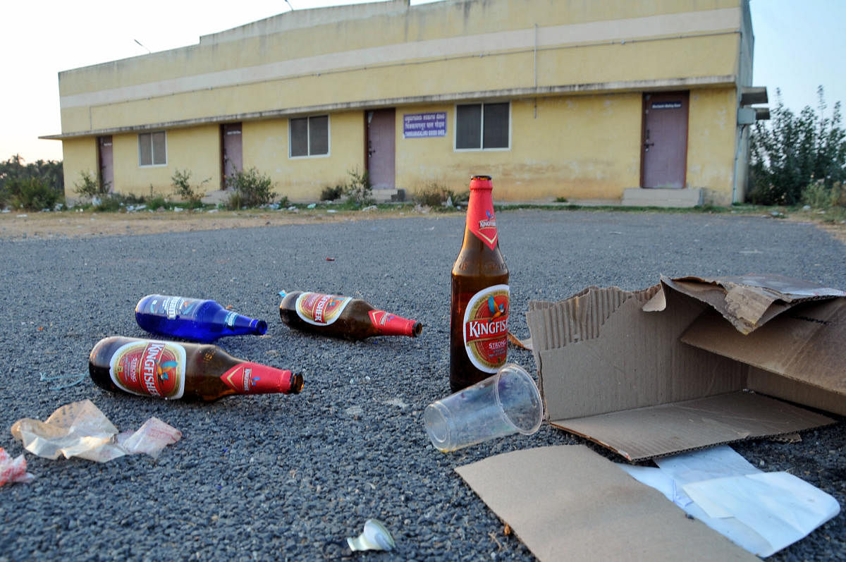 Liquor bottles strewn near the goods room of Chikkamagaluru Railway Station.