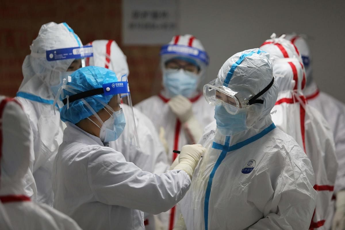 China reported 12 more imported cases of the novel coronavirus on March 16 as the capital tightened quarantine measures for international arrivals to prevent a new wave of infections. (Photo by AFP)