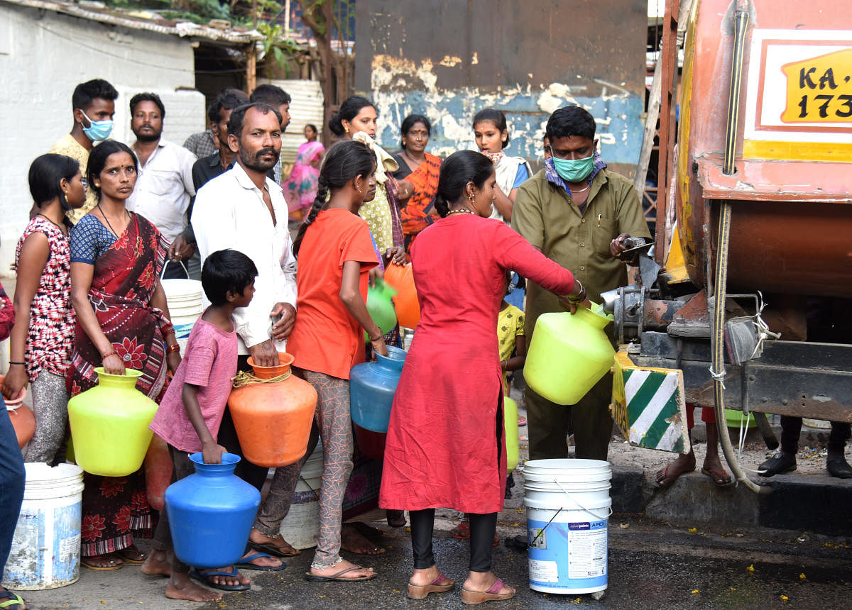 Free drinking water supplied to construction workers at K H Road in Bengaluru on Friday. DH Photo/S K Dinesh